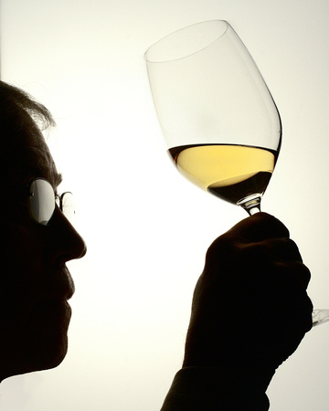 Self portrait examining the wine's color