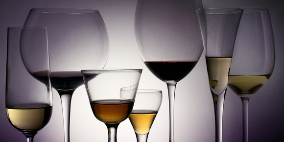 Seven wine glasses with wine
