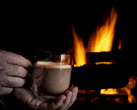 Enjoying Hot Chocolate by the Fireplace